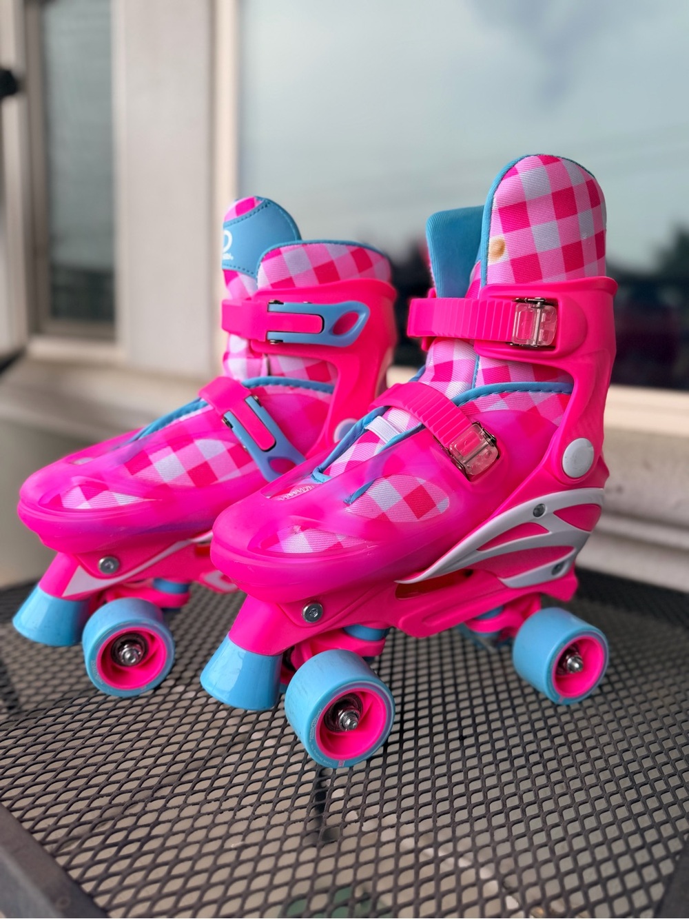 Adjustable Kids Pink Quad Roller Skates with Blue Accents